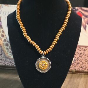 Elegant Gold Beaded Necklace with Silver Pendant